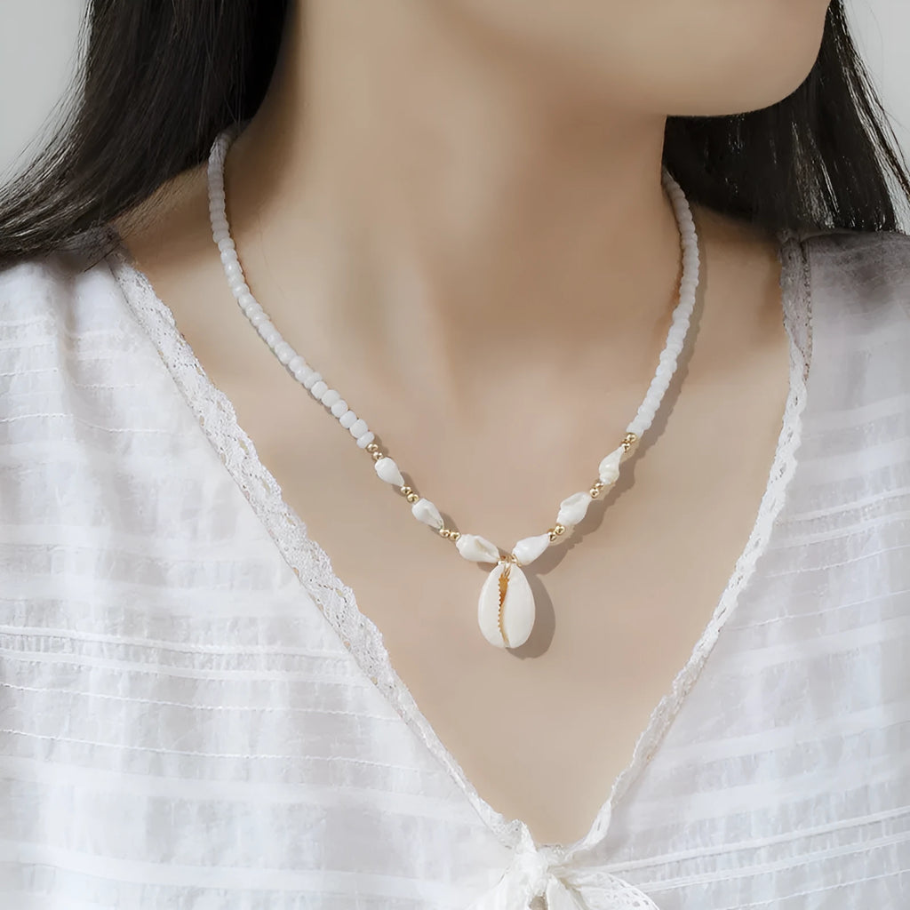 White Mother of Pearl conch shell pendant necklace on an electroplated chain.