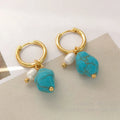 Irregular turquoise and cultured pearl earrings with geometric copper settings in both dangle and stud styles