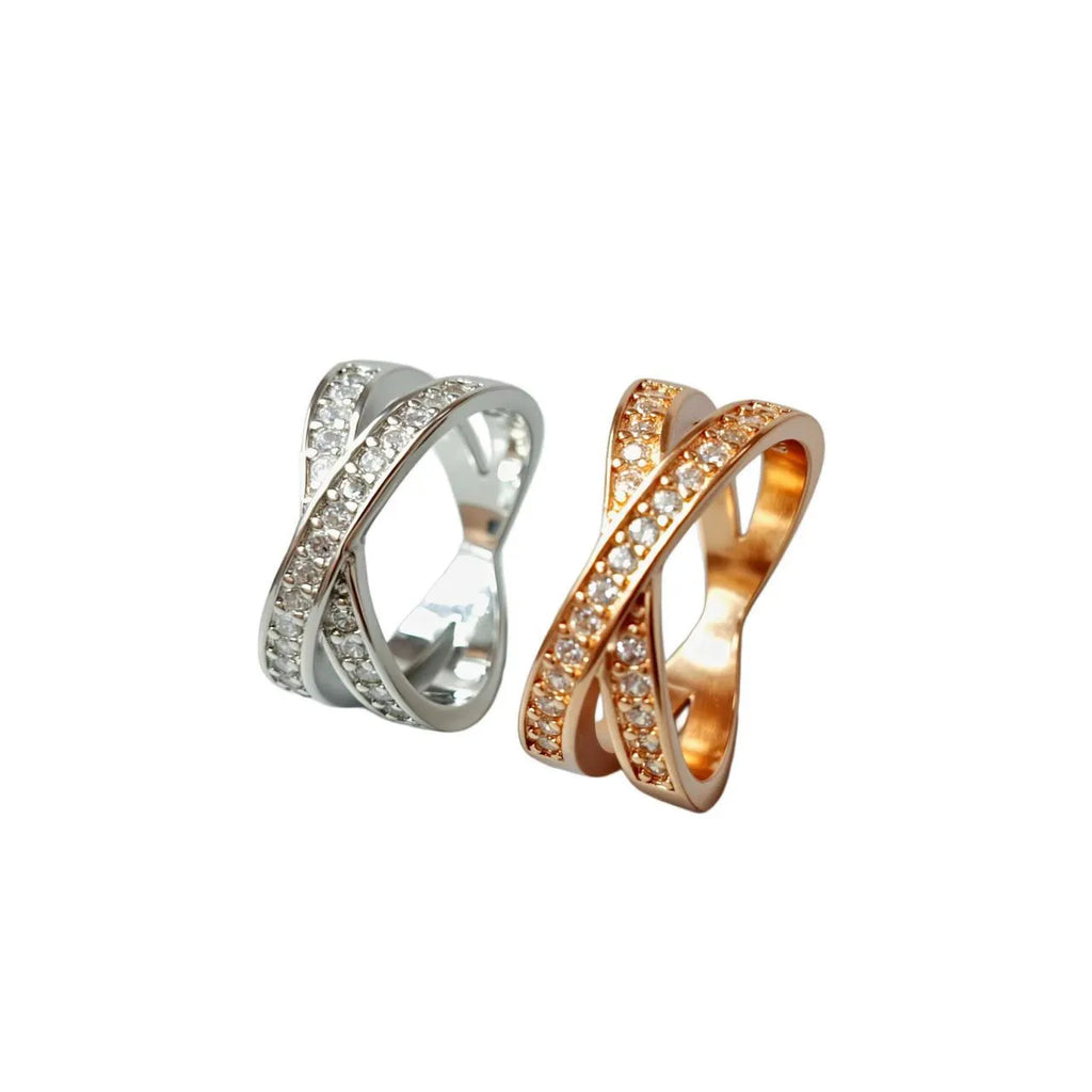 A silver or rose gold metal ring featuring a cross design with micro-inlaid zircon stones, shown in sizes 6 to 9.