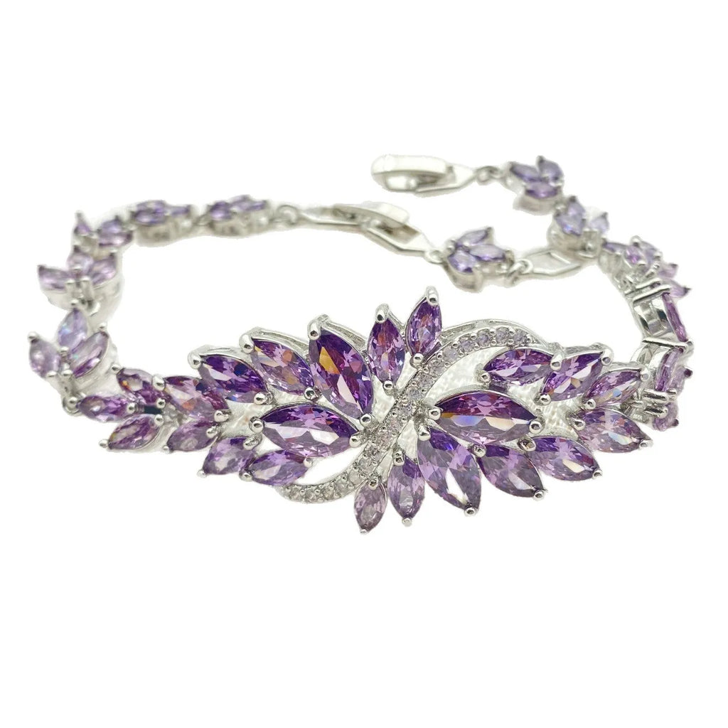 Gold electroplated copper fashion bracelet with zircon stones and ice flower design in multiple colours.