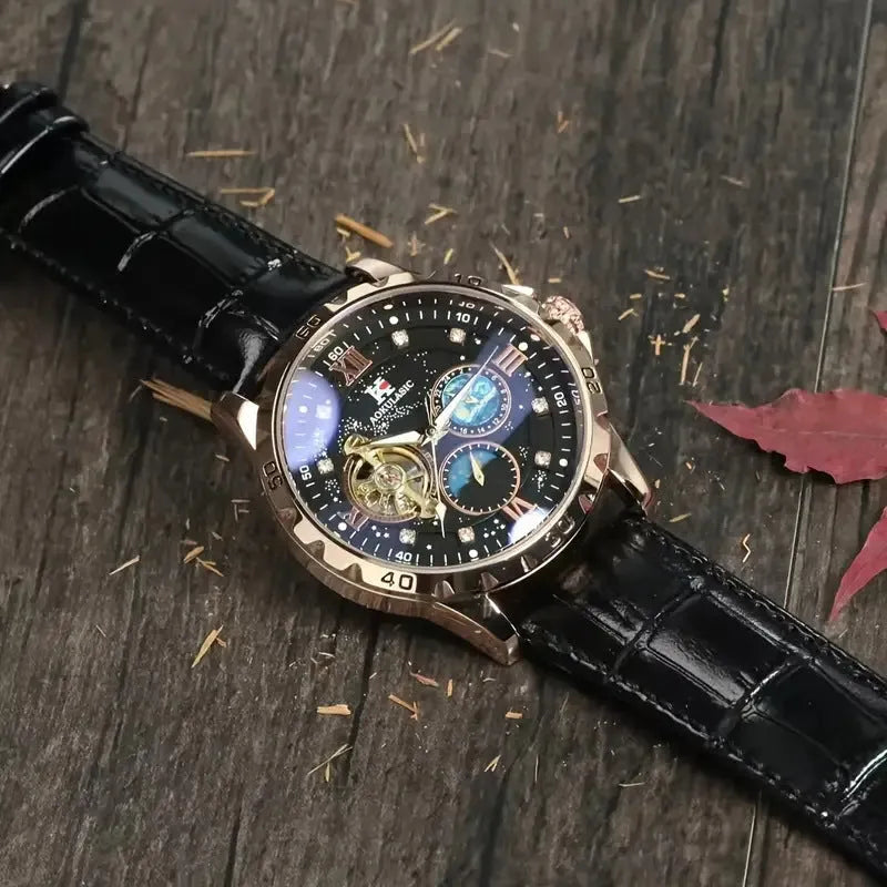 Men's automatic mechanical watch with black hollow dial and rose gold case on a leather strap.