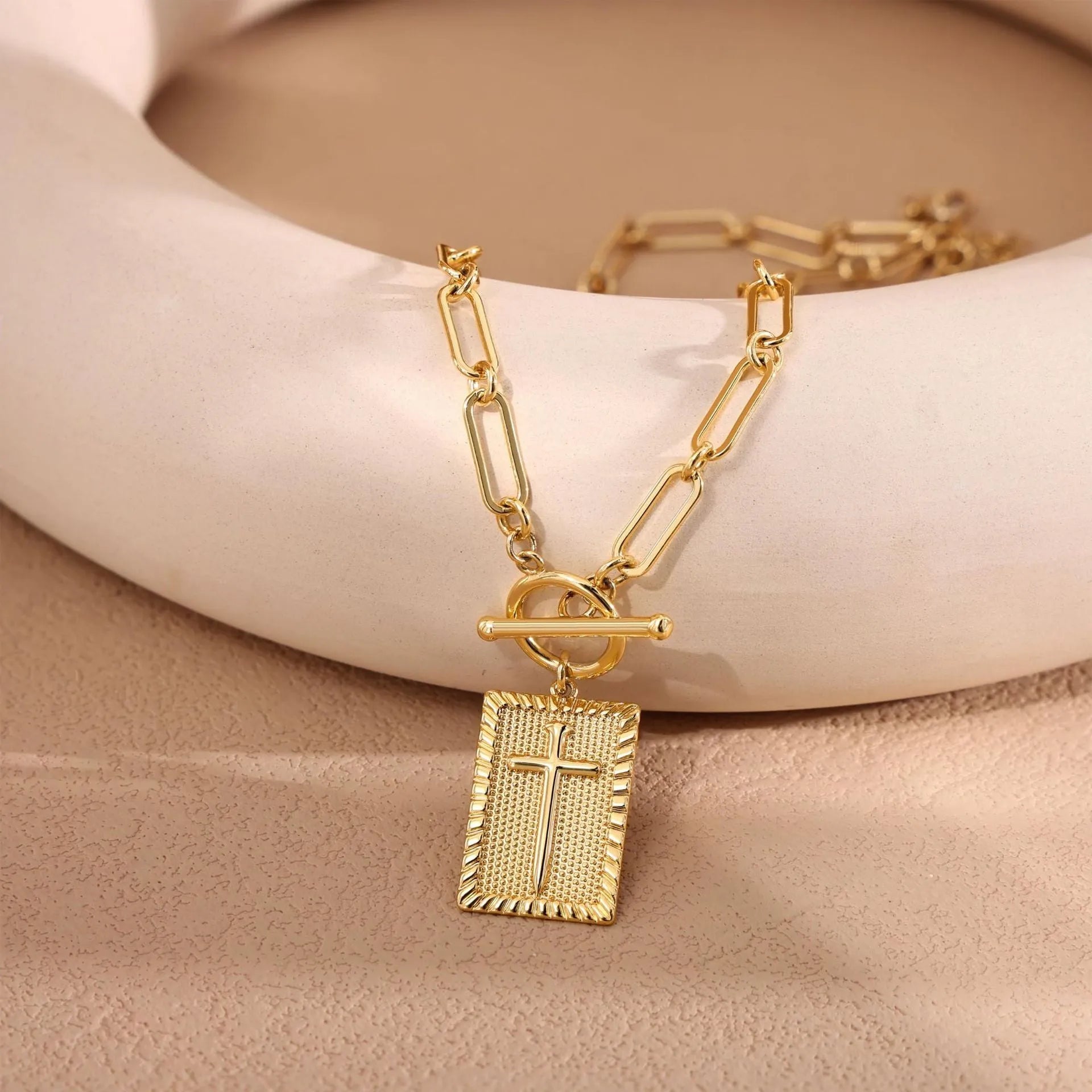 Gold stainless steel clip necklace with cross and square pendant on clip chain