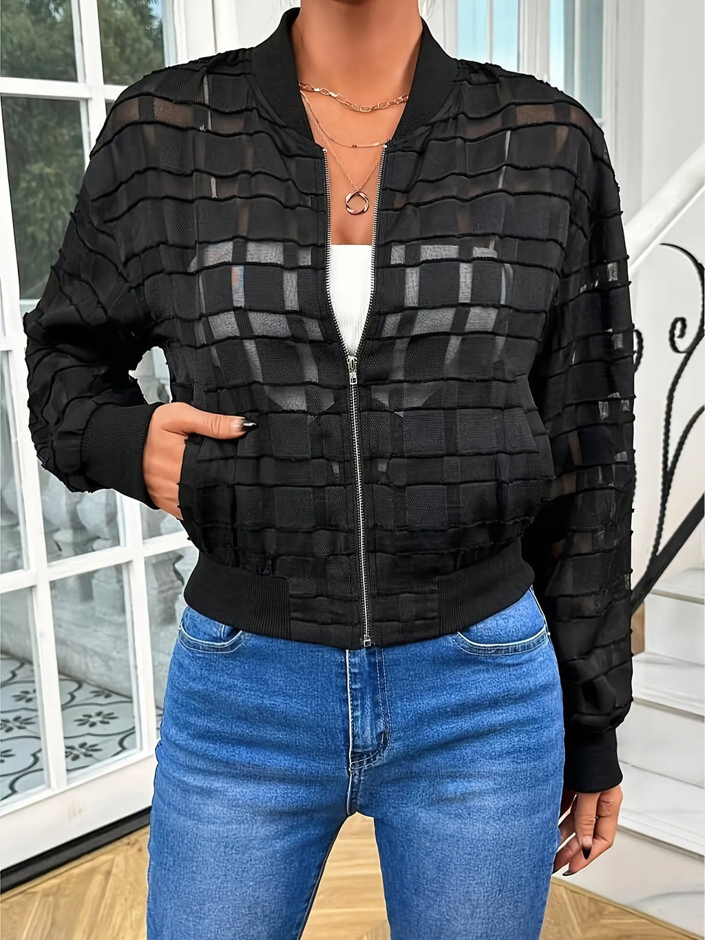 Women's black semi-transparent geometric pattern jacket with front zipper and long sleeves