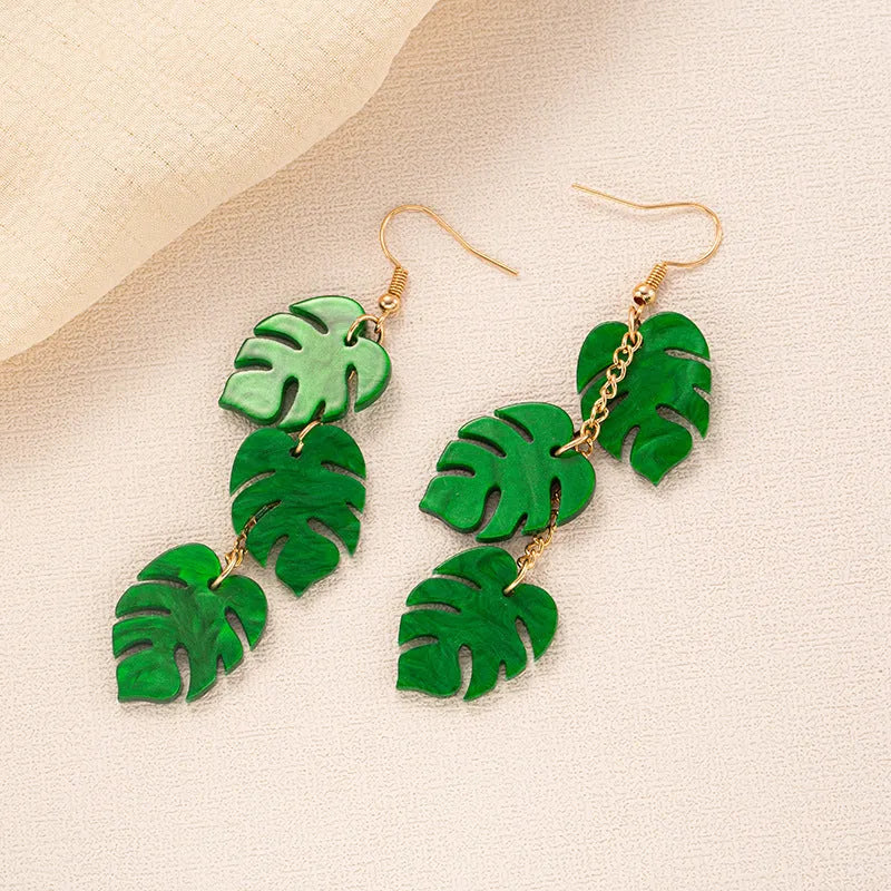 Colourful coconut artocarpus drop charm earrings on an alloy ear hook, shown in one of five style colours.