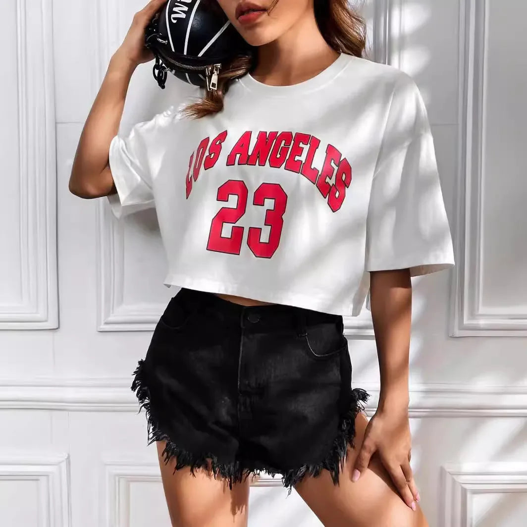 A black loose-fit cotton T-shirt with white printed English letters and a short navel-baring cut.