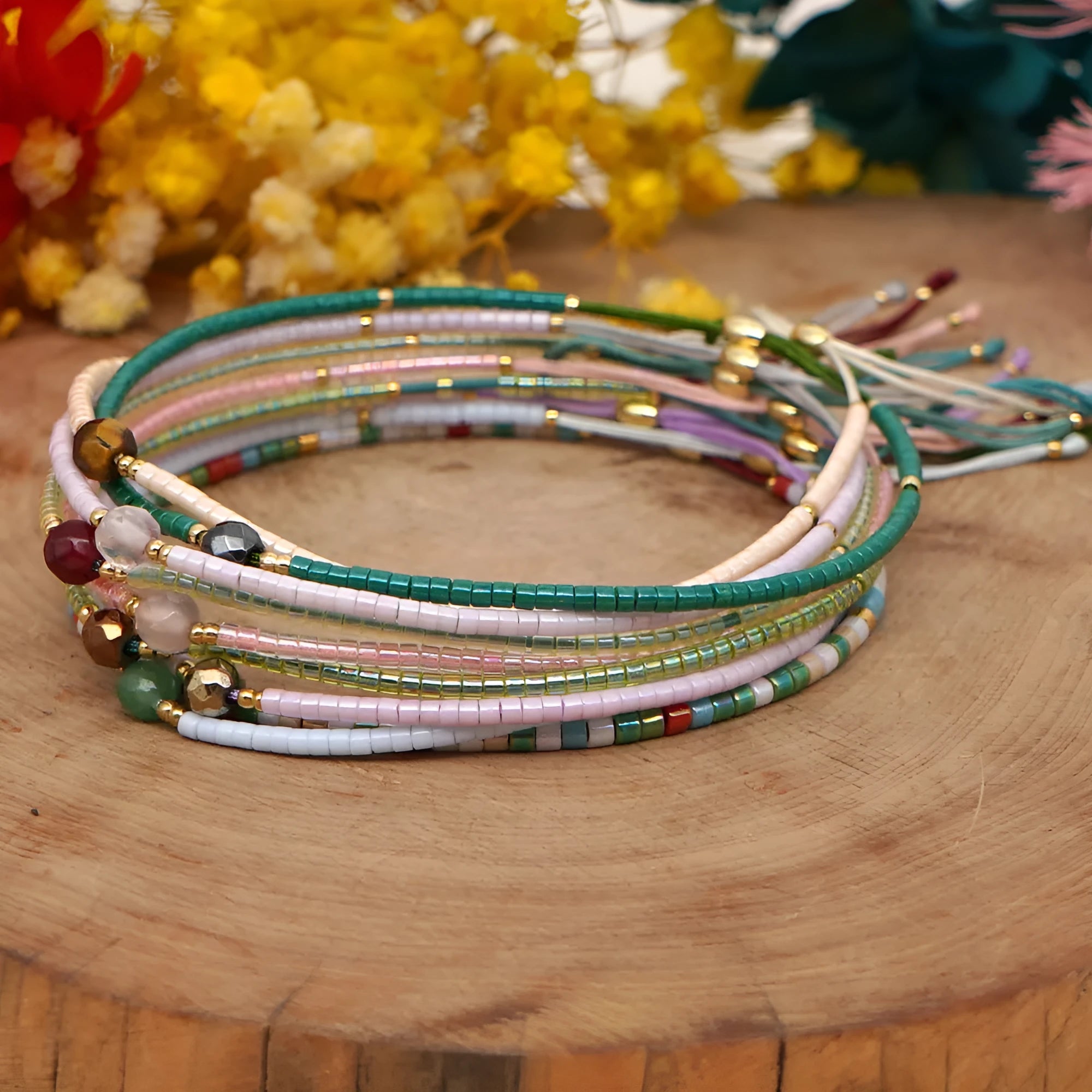 Handmade glass beaded bracelet with geometric design and semi-precious stone lucky bead charm