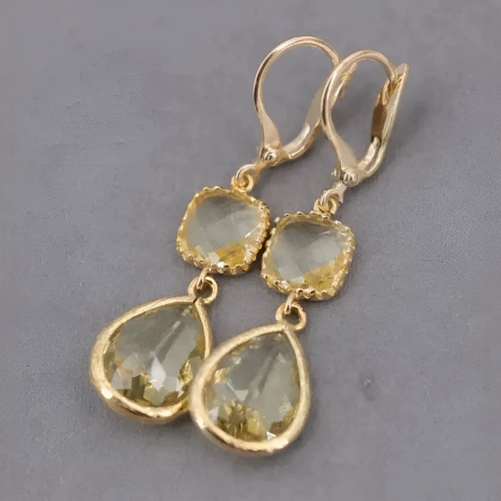 Gold geometric earrings with long crystal fringe and water droplet design
