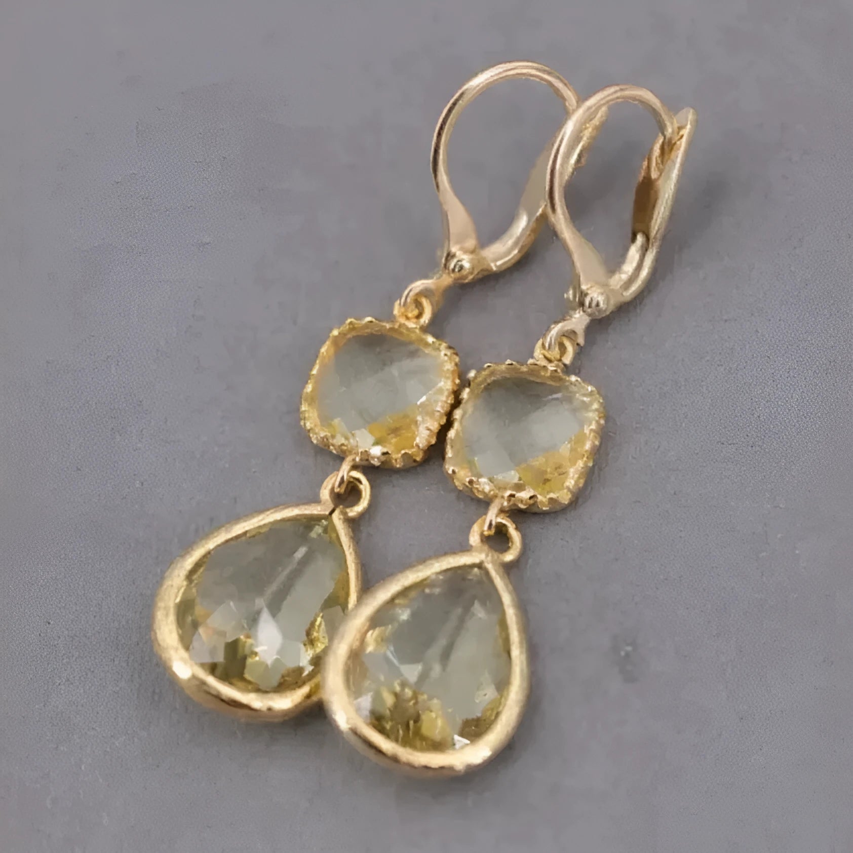 Gold geometric earrings with long crystal fringe and water droplet design