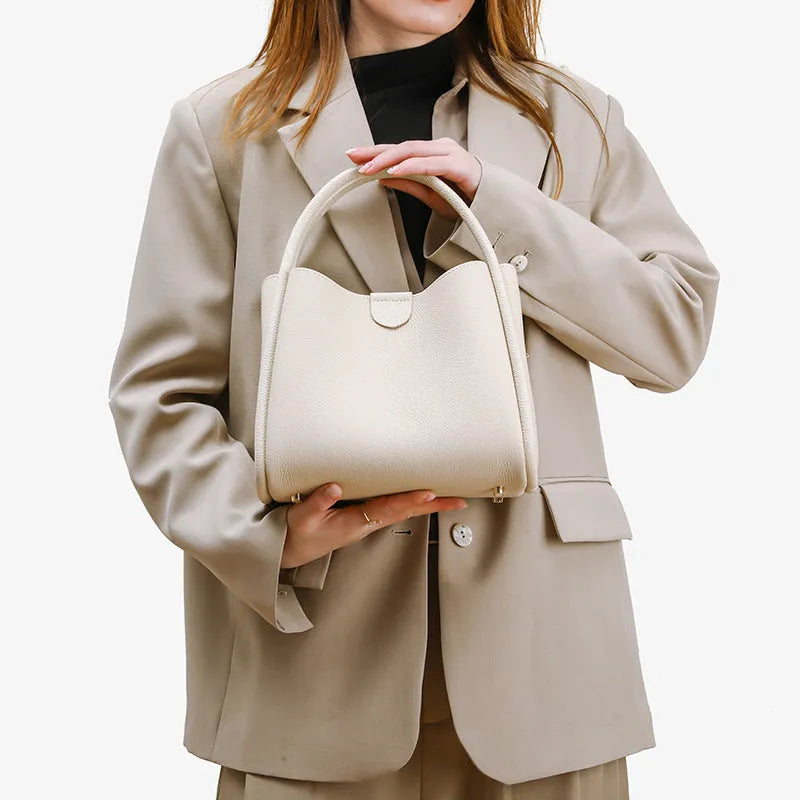 Genuine leather vegetable basket handbag in cylindrical shape with open pocket outer and sandwich zipper bag interior