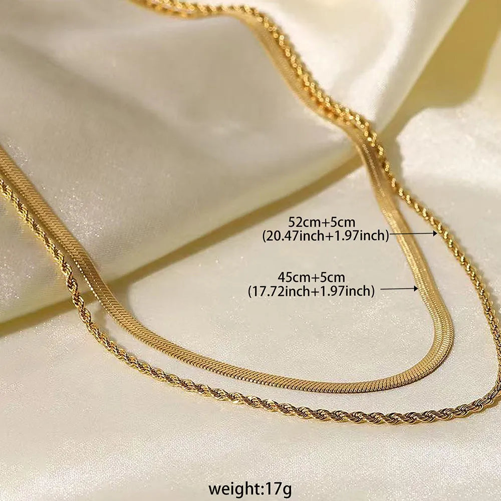 Women's silver-tone geometric double-layer twist pendant necklace on a snake bone chain.