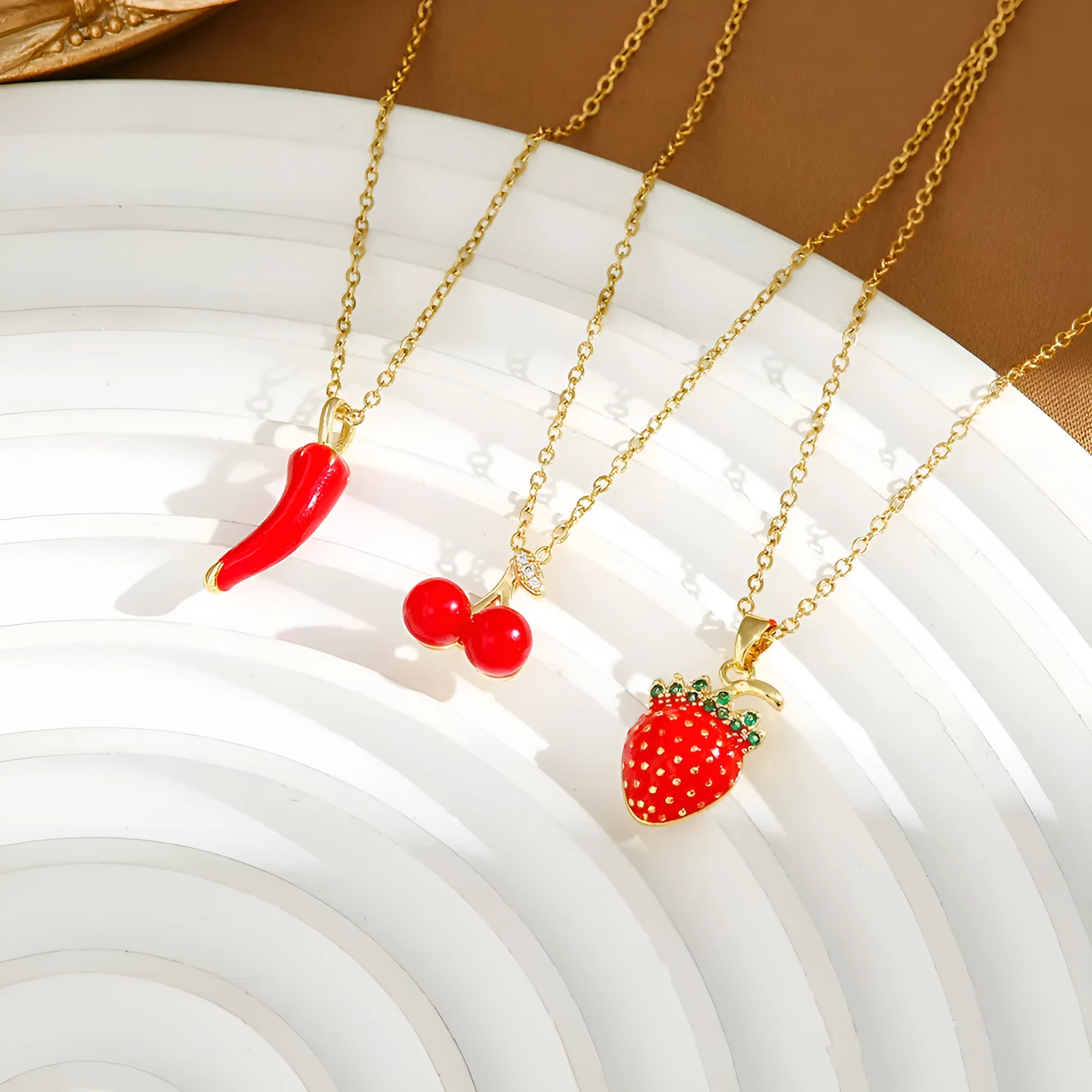 Titanium steel necklace with an indie-style cherry, strawberry, and pepper pendant on an O-ring chain.