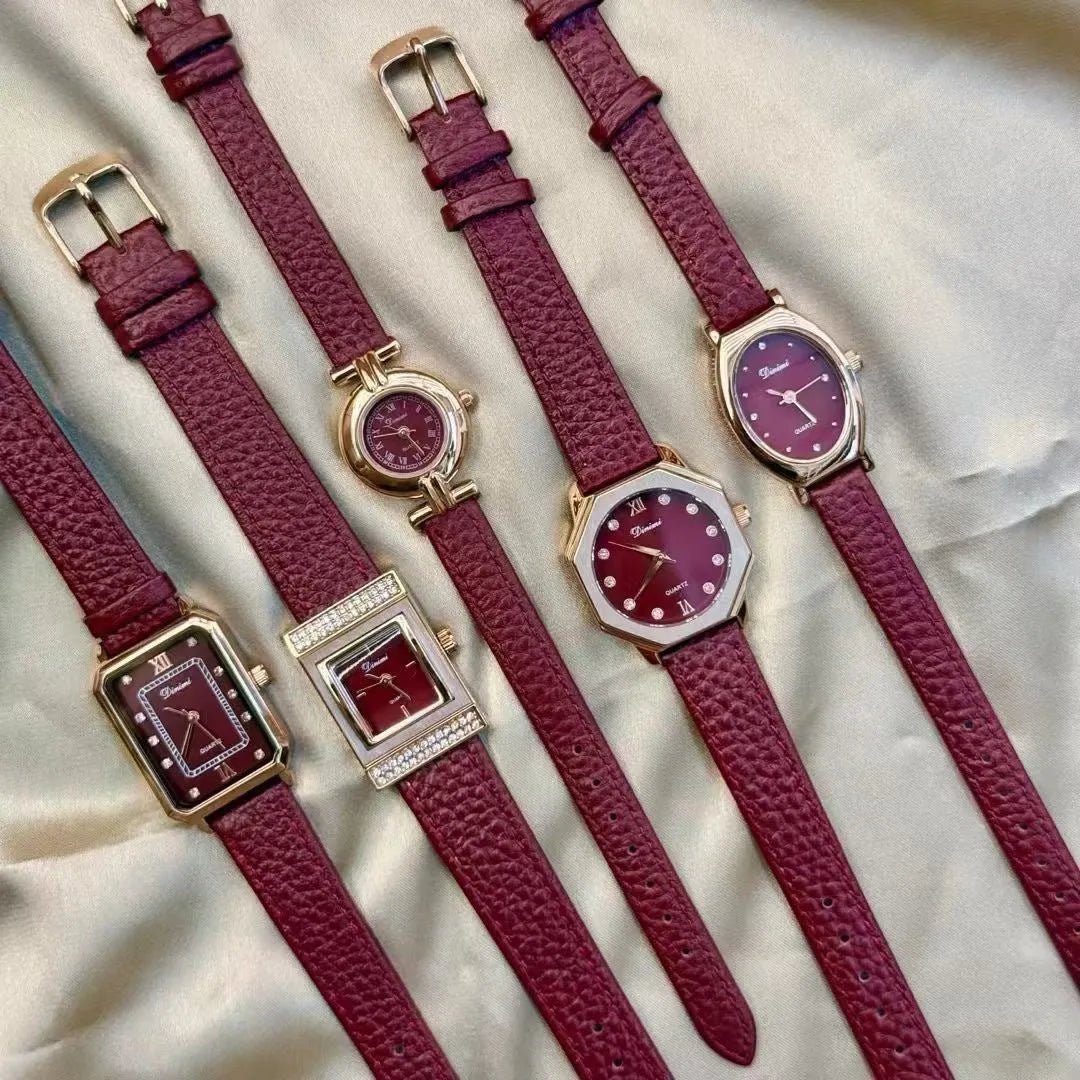 Red dial women's alloy watch with Chinese style decorative design on wrist.
