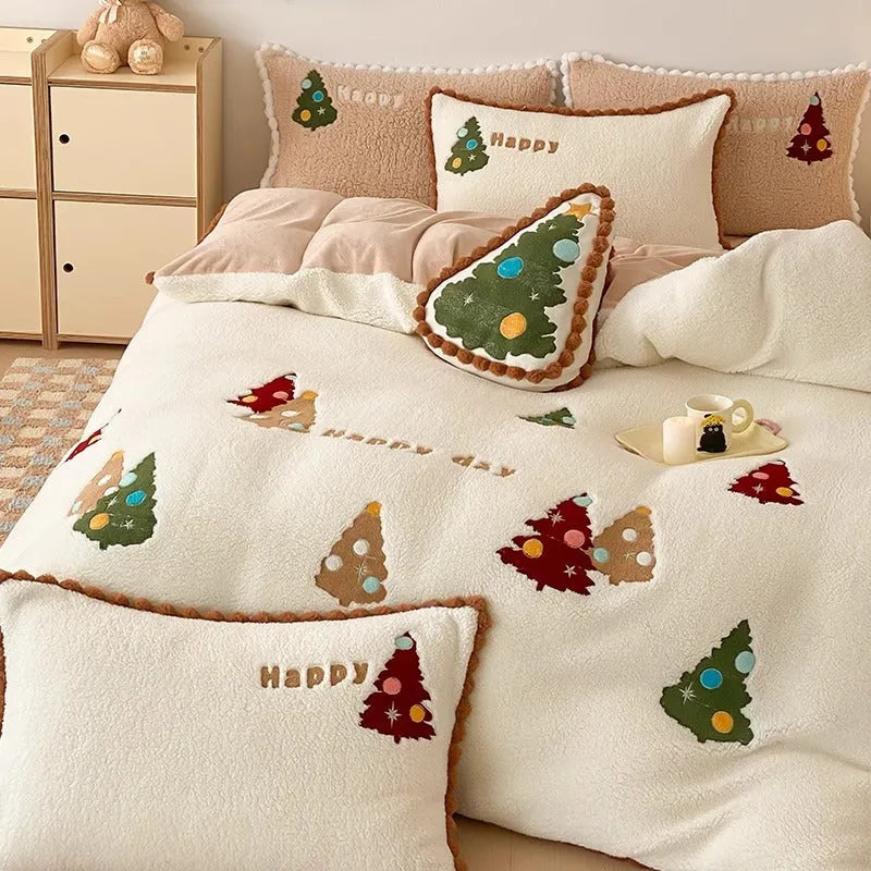 Bright yellow four-piece bedding set with a cartoon Christmas tree pattern, shown on a bed.
