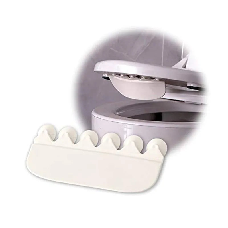 White PVC toilet urine blocking board for children's training placed on toilet rim