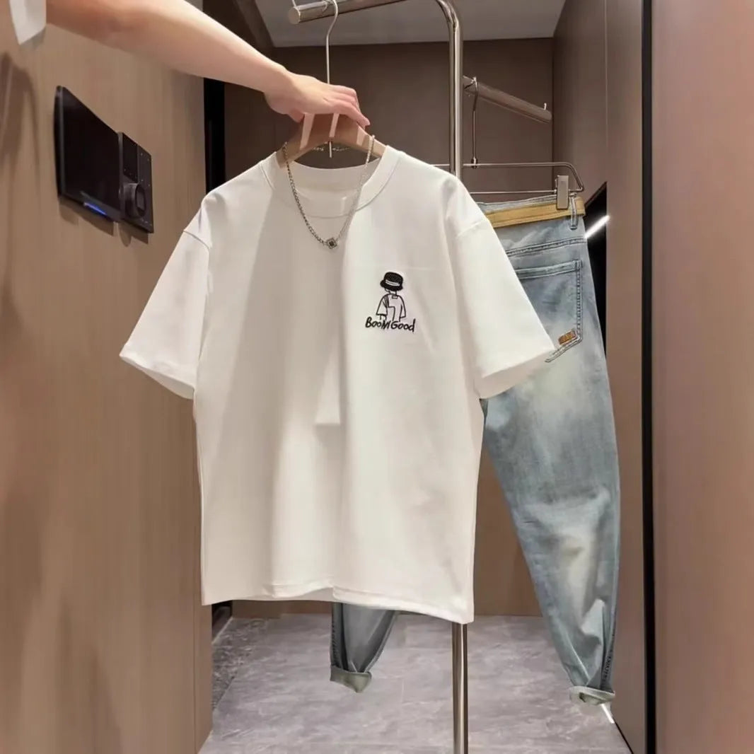 Men's black and white cotton short sleeve crew neck t-shirt on a hanger