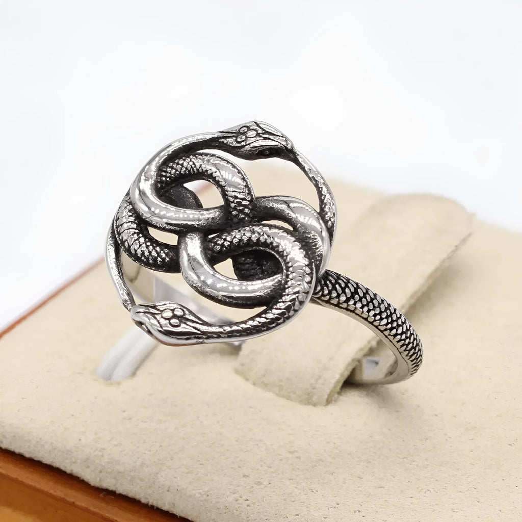 A steel-coloured titanium steel ring featuring a detailed double snake design in a retro style.