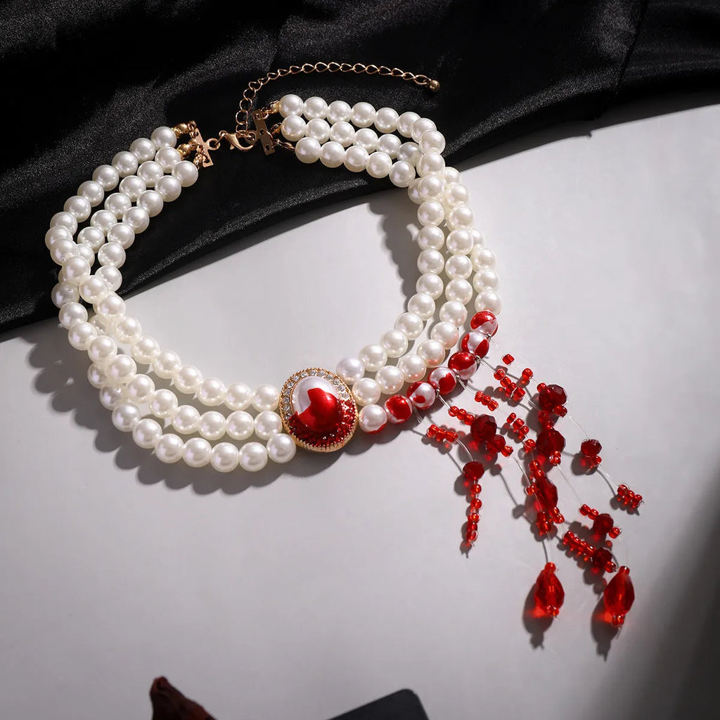 Halloween pearl collar necklace set with U-shaped design, matching bracelet, and stud earrings in gold finishes