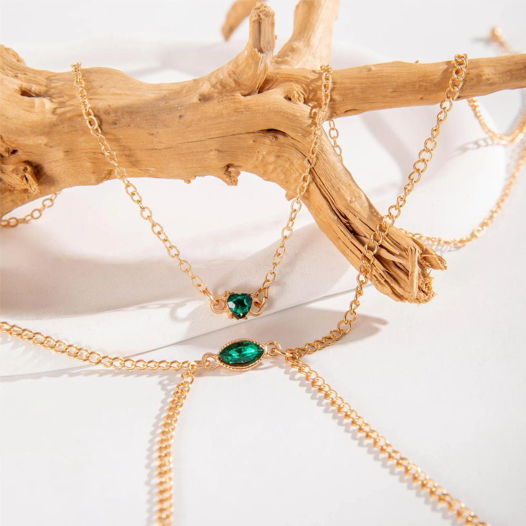 Men's simple gold-toned alloy body chain necklace with electroplated 25729 gold finish on a plain background.