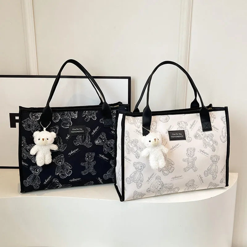 Women's printed canvas tote bag with rhombus pattern and sandwich pockets in black colour option