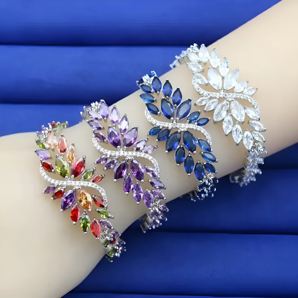 Gold electroplated copper fashion bracelet with zircon stones and ice flower design in multiple colours.