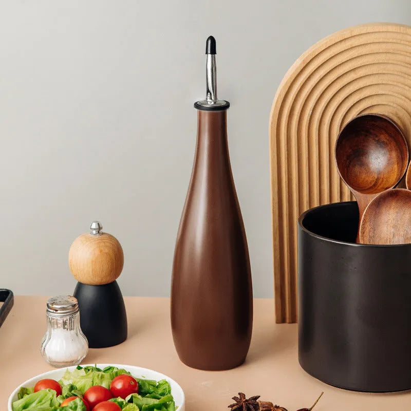 Ceramic kitchen oil pot with sealed spout and conical funnel for cooking oil storage