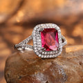 Copper geometric square ring with rhinestones in F827 red, shown on a finger.