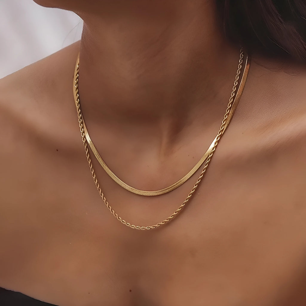 Women's silver-tone geometric double-layer twist pendant necklace on a snake bone chain.