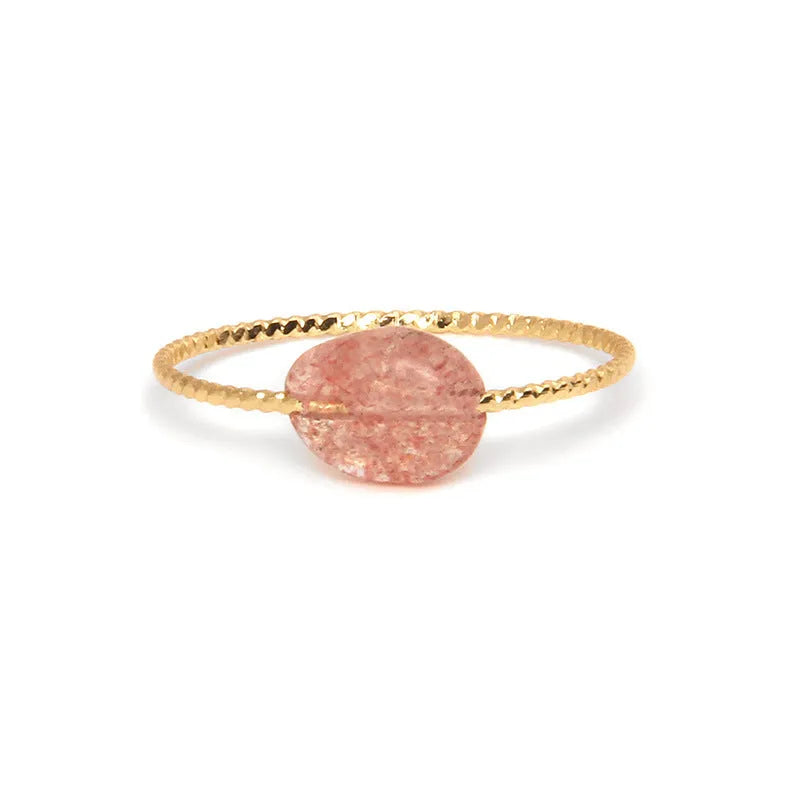 Close-up of a women's geometric agate ring showing its original design and coloured stone.