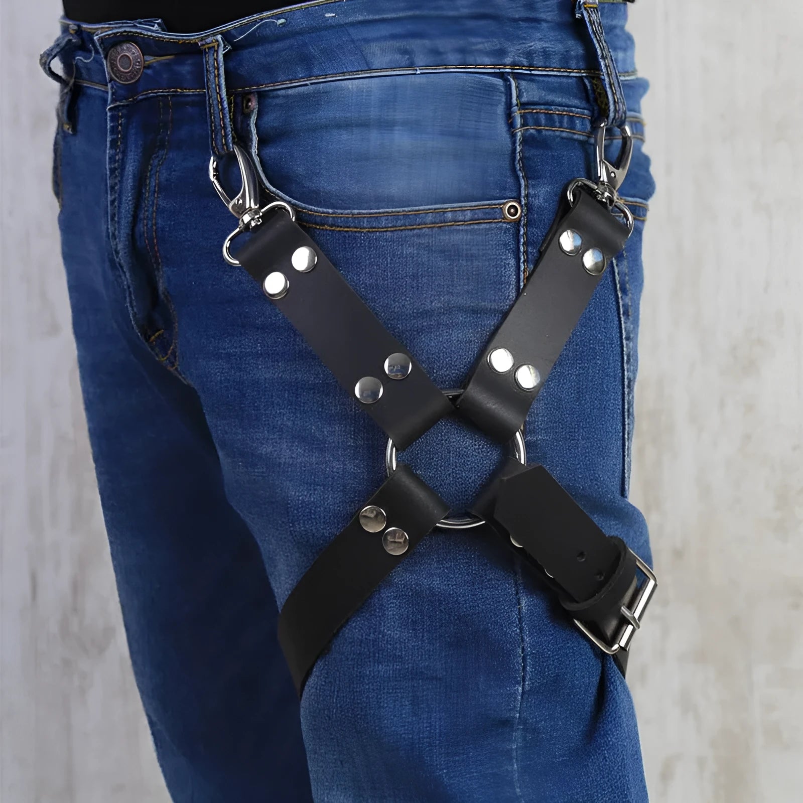 Black PU leather leggings with an elasticated waistband laid flat.