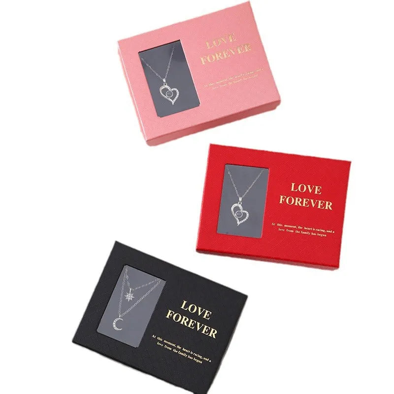 Six red soap flowers arranged in a black gift box with a matching handbag, a Valentine's Day gift set.