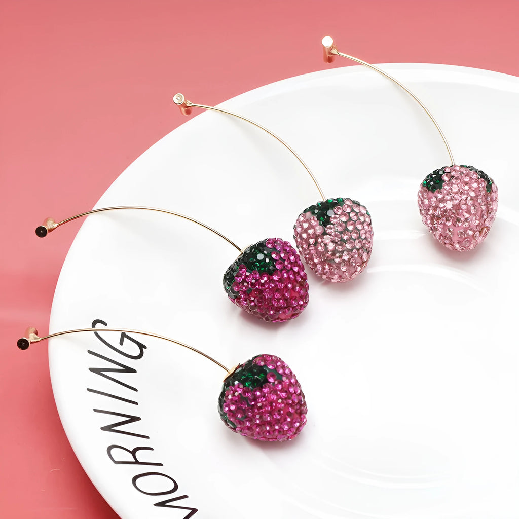 A pair of geometric strawberry-shaped stud earrings with spot drill texture, shown in red zinc alloy.