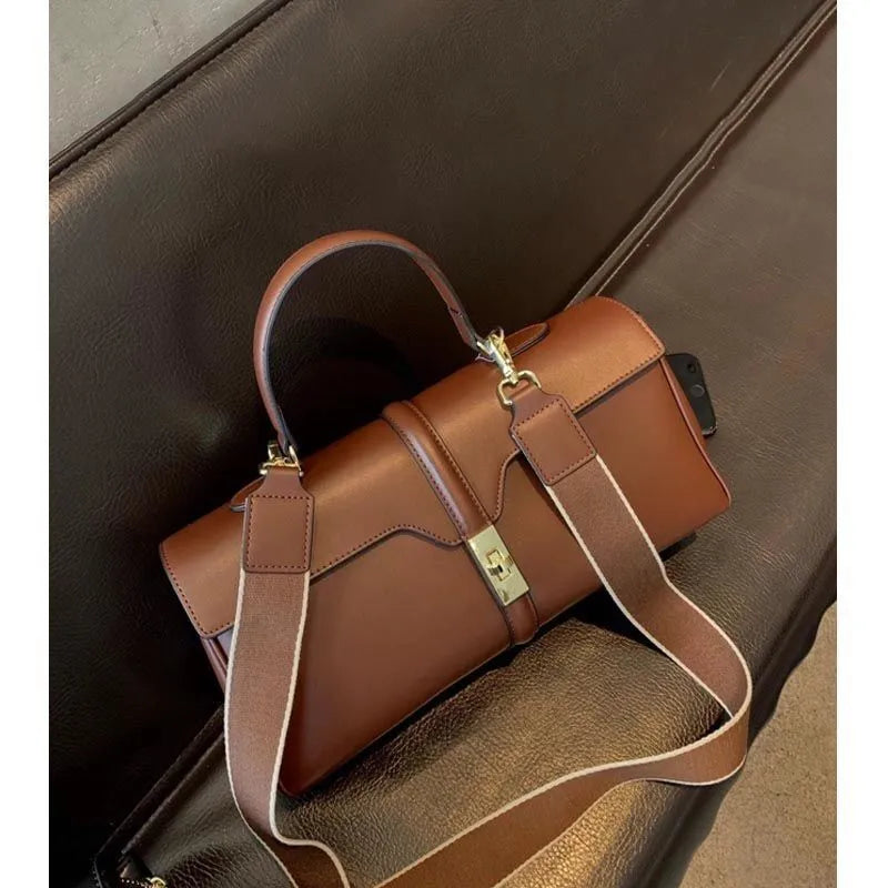 Women's cylindrical cowhide messenger bag in European-American retro style with organiser compartments