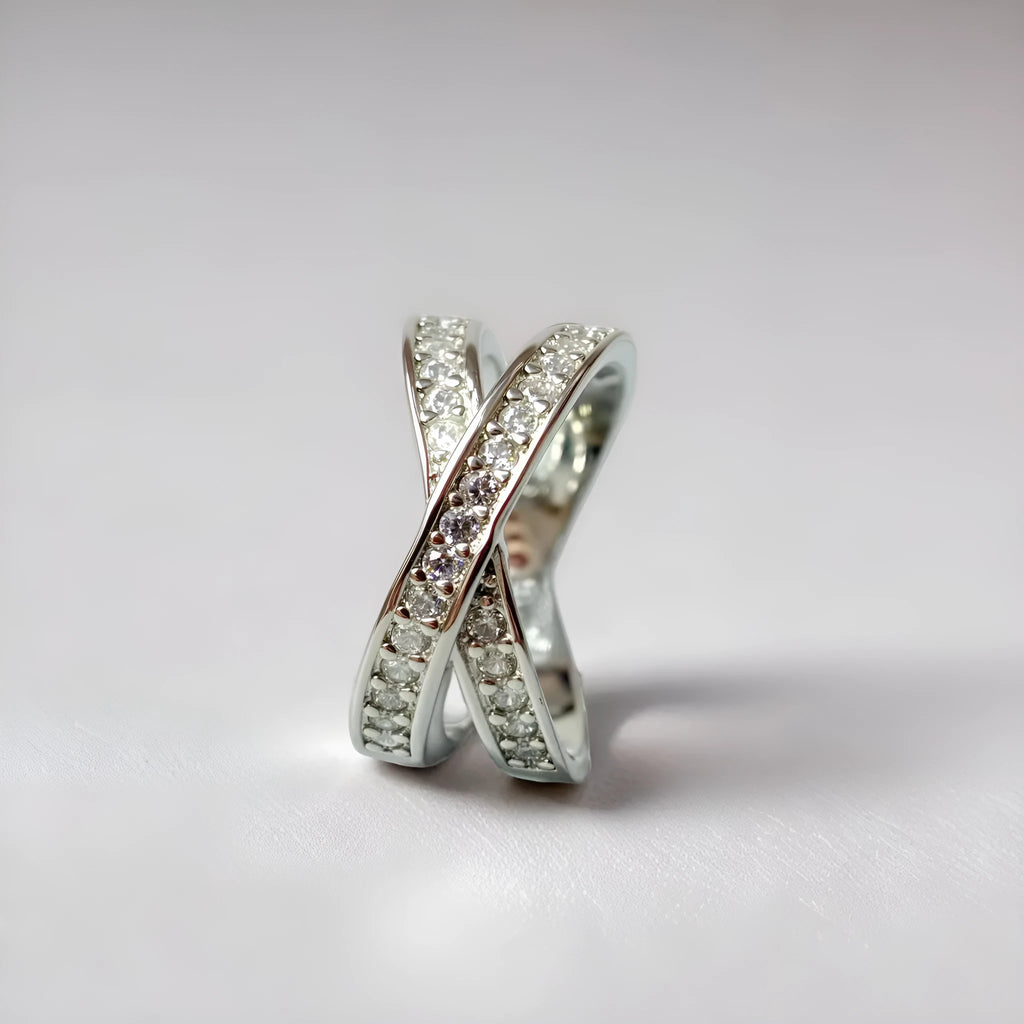 A silver or rose gold metal ring featuring a cross design with micro-inlaid zircon stones, shown in sizes 6 to 9.