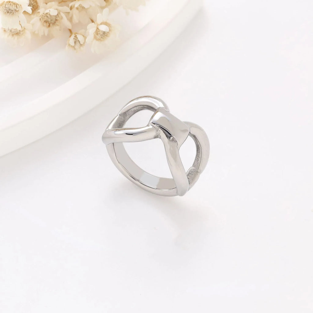 Gold or steel colour titanium steel women's ring with hollow bow shape and butterfly geometric design.