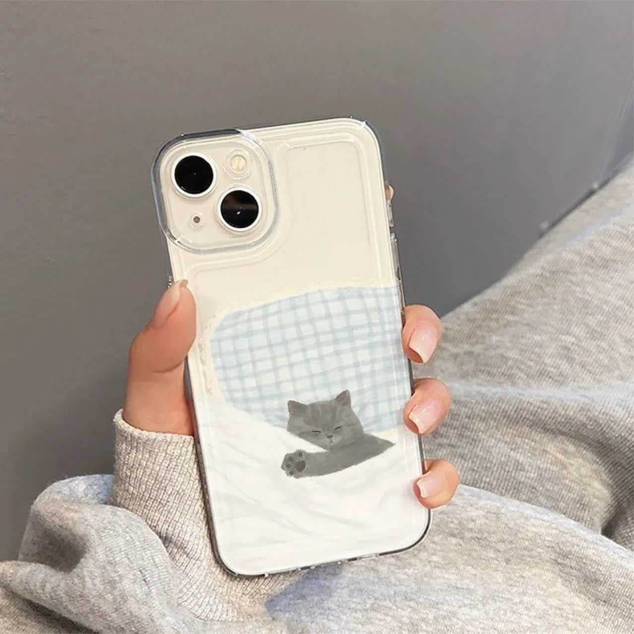 Transparent phone case showing sleeping cat pattern for Apple iPhone with TPU shockproof protection
