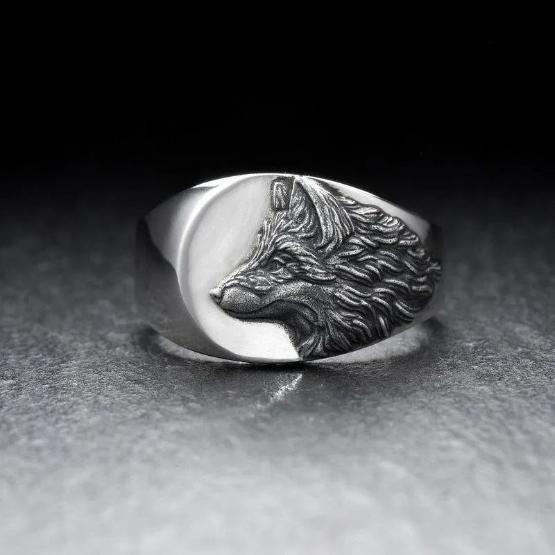 Men's silver geometric wolf-shaped alloy ring on a grey background.