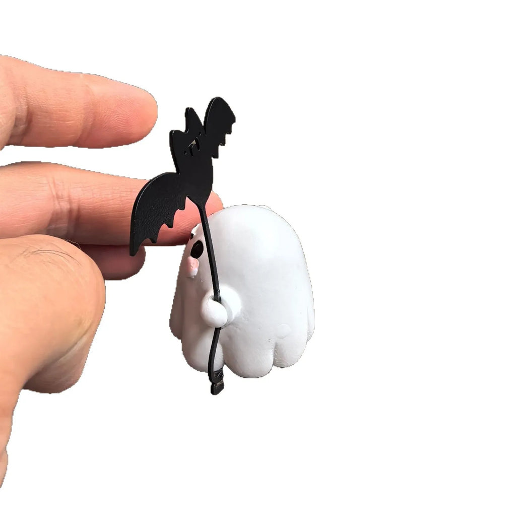 Mini resin statue of a ghost walking a dog and holding a bat, Halloween decoration.