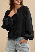 Women's loose fit sweater with lace-stitch half-open collar and long sleeves in a solid colour.