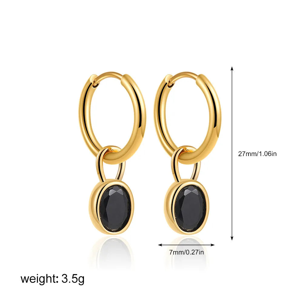 Women's oval-shaped retro zircon earrings in copper, shown in emerald green colour.