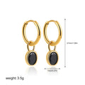 Women's oval-shaped retro zircon earrings in copper, shown in emerald green colour.
