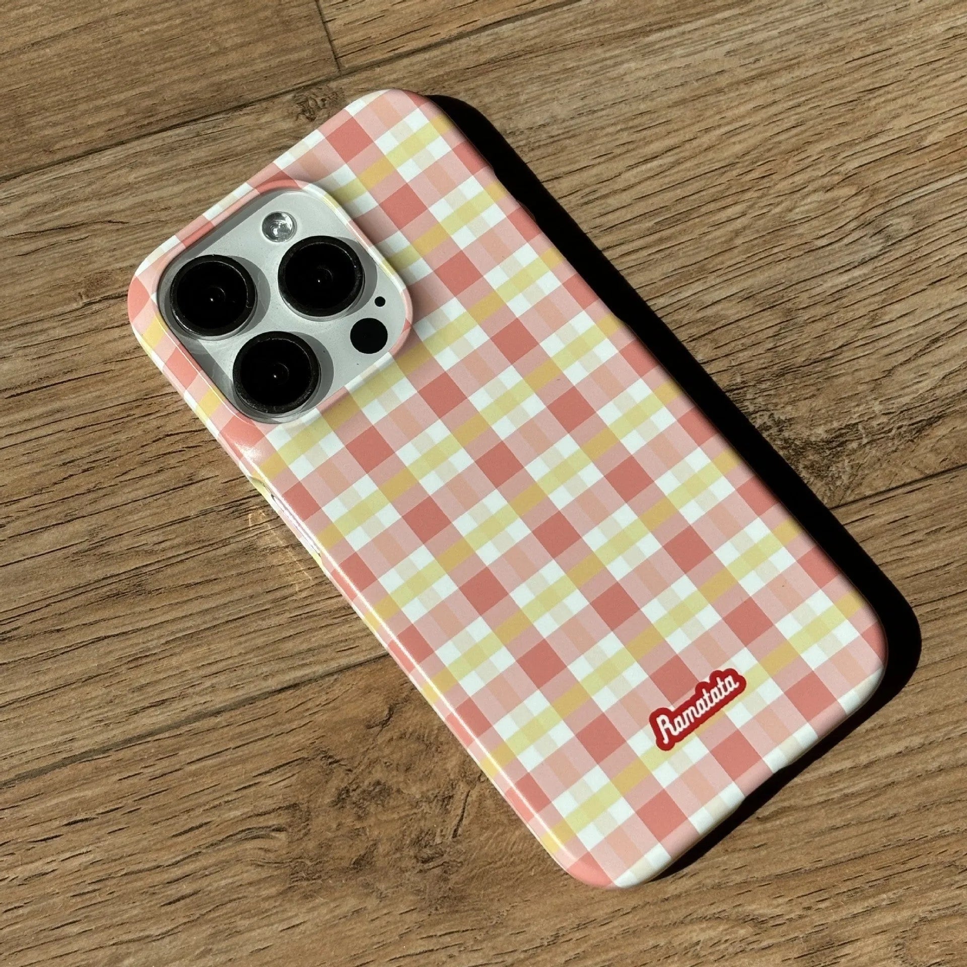 Original plaid design iPhone 15 Pro Max phone case in red and orange grid patterns with frosted and glossy finish options.