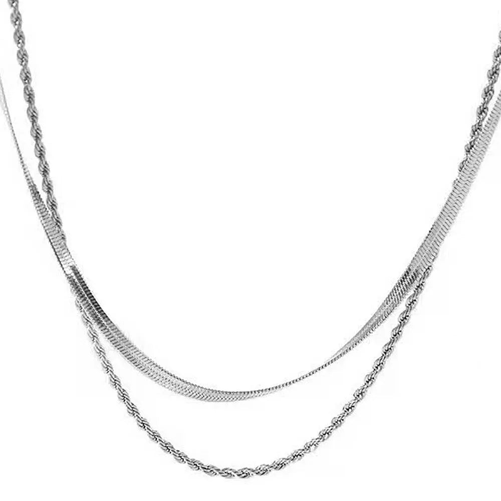 Women's silver-tone geometric double-layer twist pendant necklace on a snake bone chain.