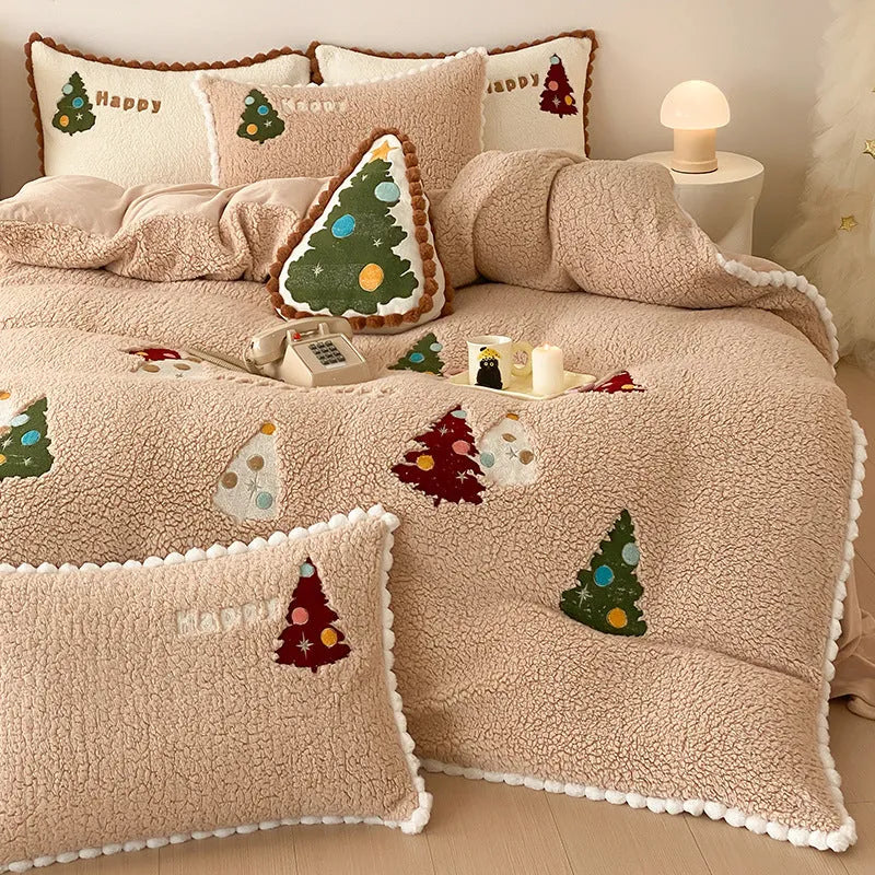 Bright yellow four-piece bedding set with a cartoon Christmas tree pattern, shown on a bed.