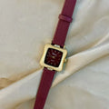 Red dial women's alloy watch with Chinese style decorative design on wrist.