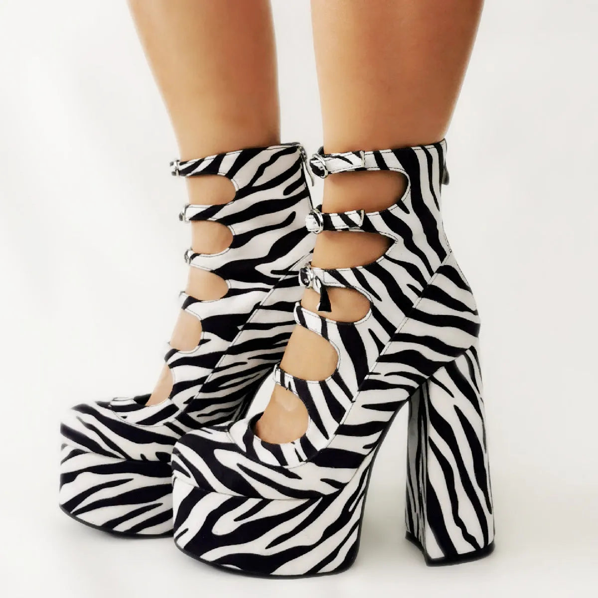 Black waterproof patent leather women's platform high heels with a thick heel and serpentine ankle buckle.