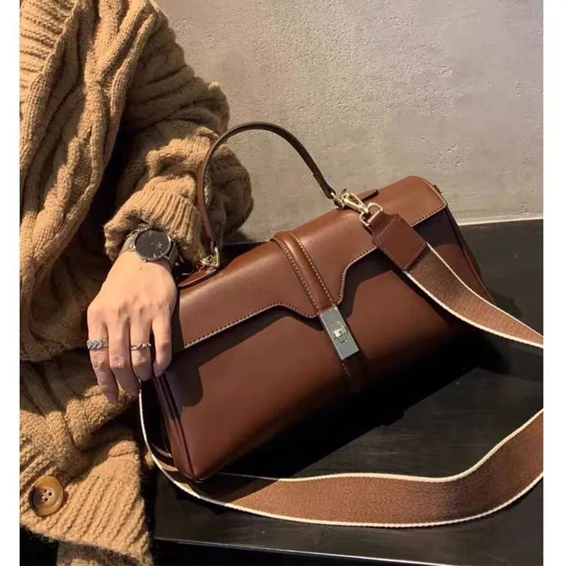 Women's cylindrical cowhide messenger bag in European-American retro style with organiser compartments