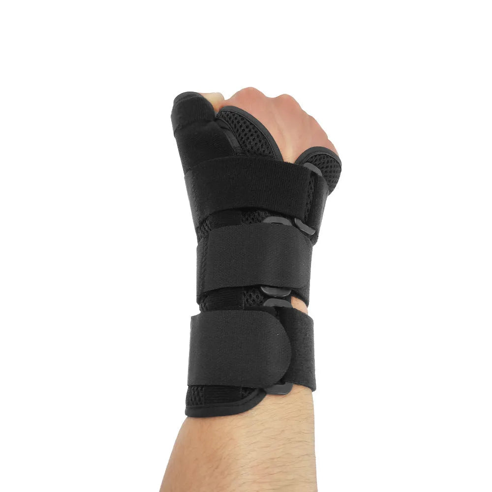 Black carbon fibre wrist guard with grey edging and thumb strap for sports support