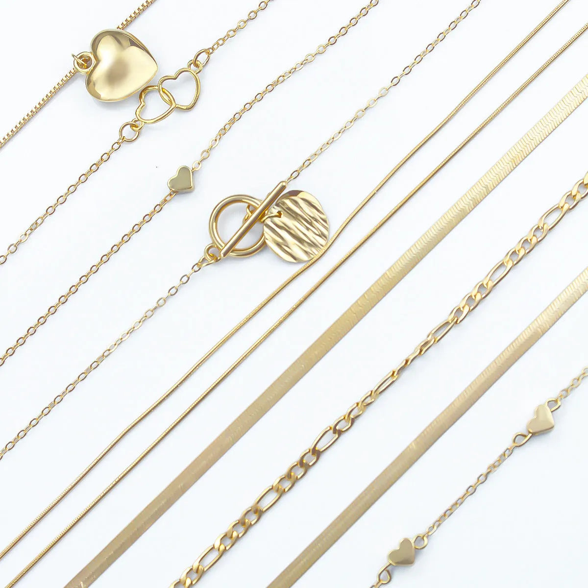 Ten gold electroplated necklaces with alloy pendants on adjustable snake bone chains