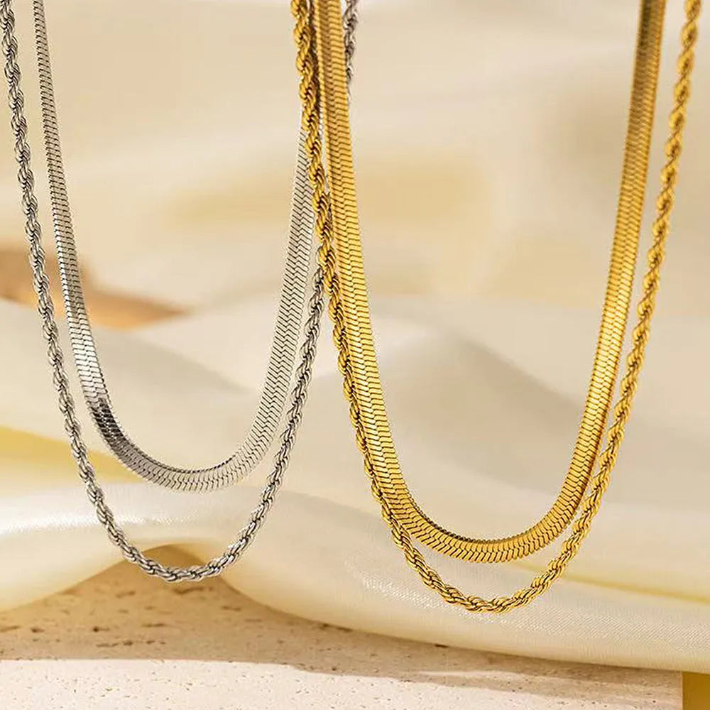 Women's silver-tone geometric double-layer twist pendant necklace on a snake bone chain.