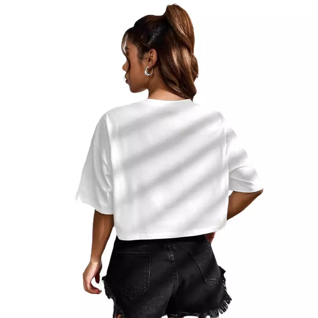 A black loose-fit cotton T-shirt with white printed English letters and a short navel-baring cut.